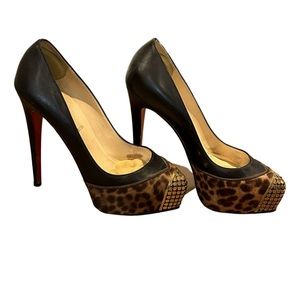 Christian Louboutin black leather and leopard heels.